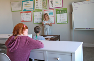 Girl standing in front of the classroom