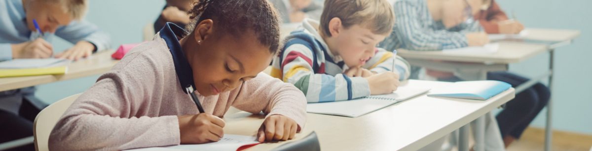 Elementary,Classroom,Of,Diverse,Bright,Children,Listening,Attentively,To,Their