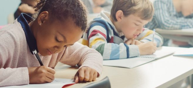 Elementary,Classroom,Of,Diverse,Bright,Children,Listening,Attentively,To,Their