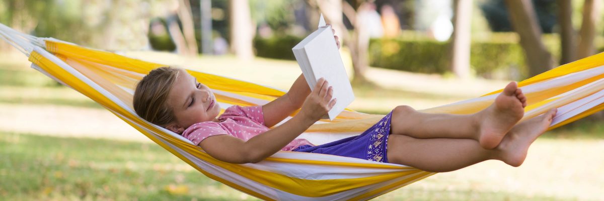 Girl reading in hammock