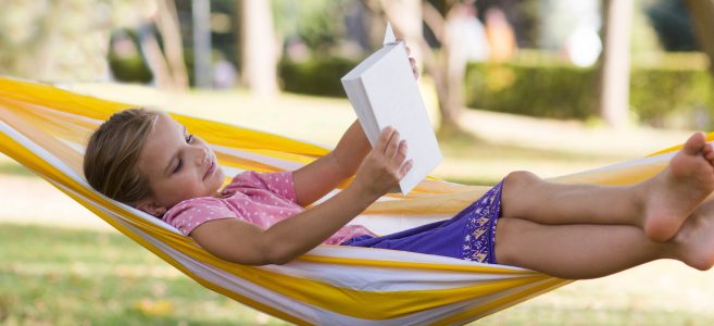 Girl reading in hammock