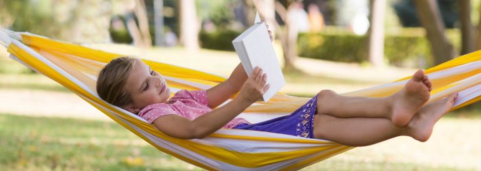 Girl reading in hammock