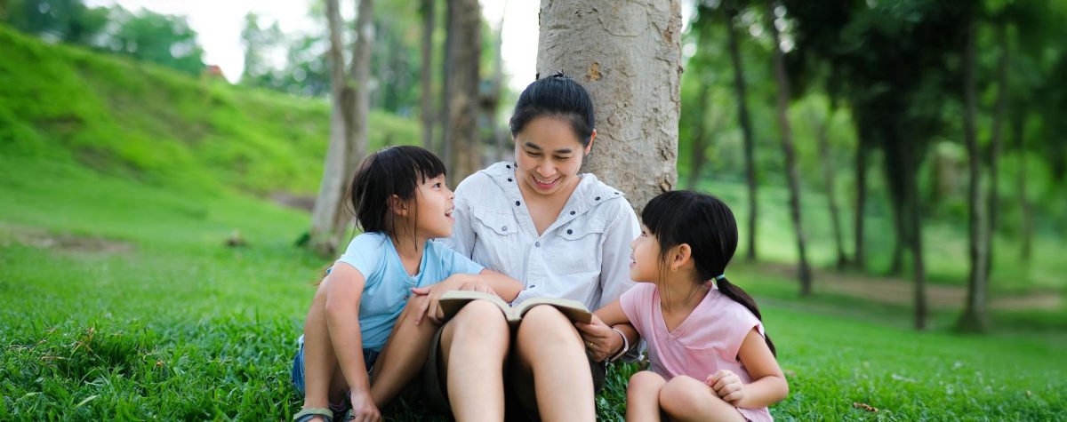 Happy,Mother,And,Two,Daughters,Having,Fun,And,Enjoying,Reading